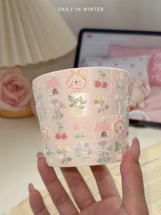 Hand-painted pink ceramic cup with floral and cherry patterns